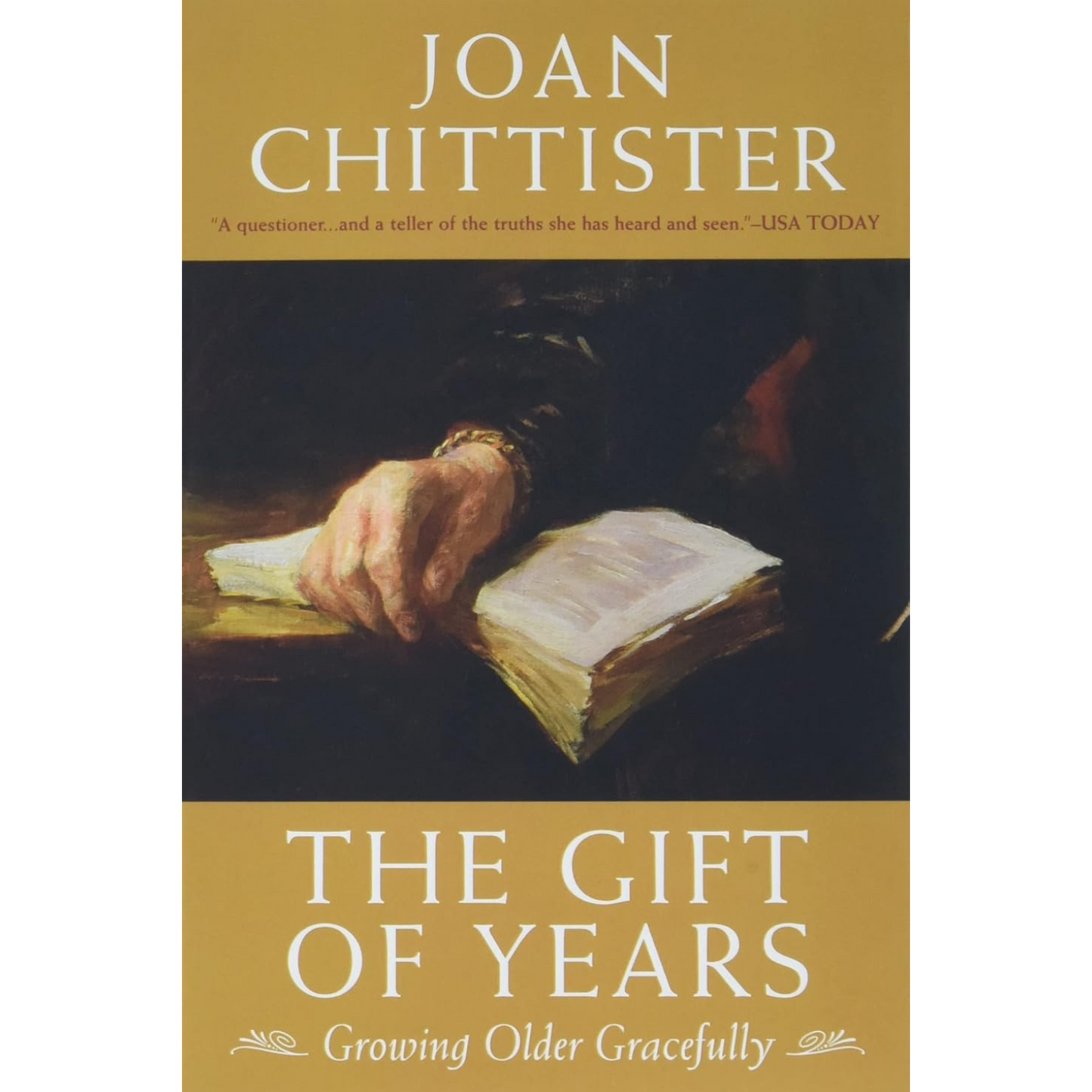 Book cover of 'The Gift of Years' by Joan Chittister with a hand on an open book.