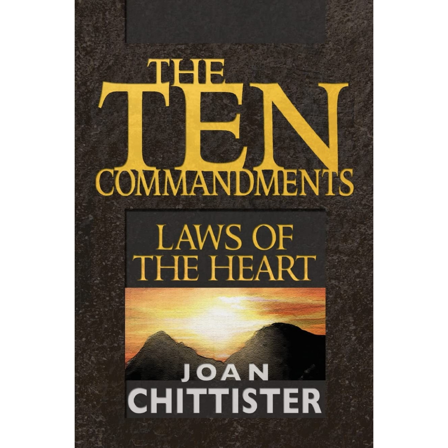 Book cover of 'The Ten Commandments: Laws of the Heart' by Joan Chittister with a mountain and sunset design.