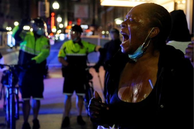 A protester in Boston screams after being affected by a chemical agent used by metro police May 31.