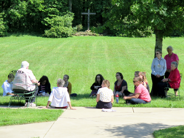 Participants in session on the monastery grounds